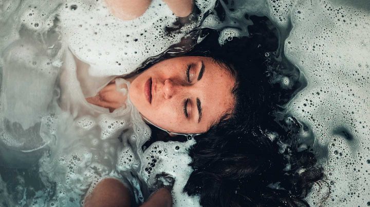 A relaxing bath can help wind down after a busy day. Photo by Craig Adderley from Pexels